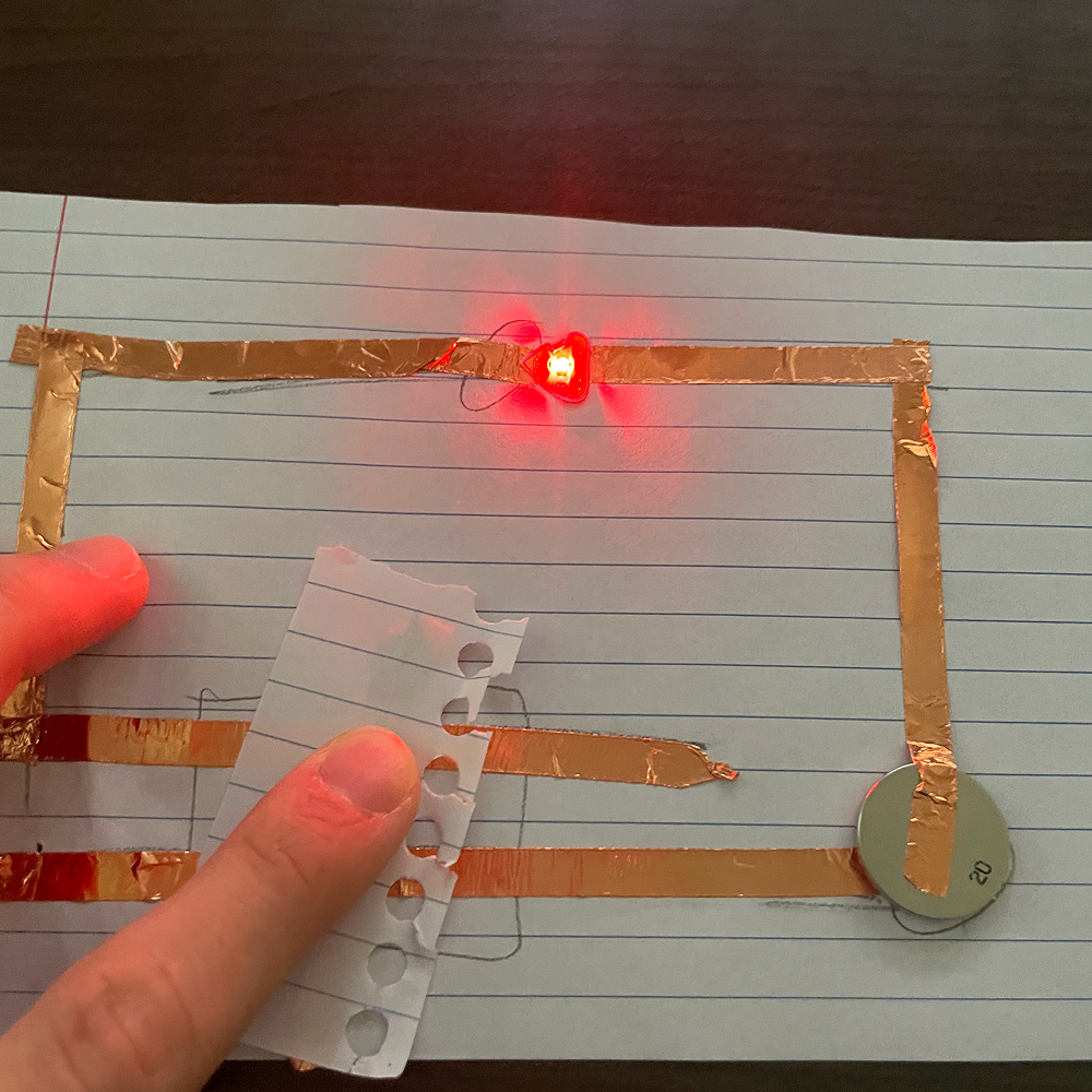 Connecting it with a basic paper with copper tape under it