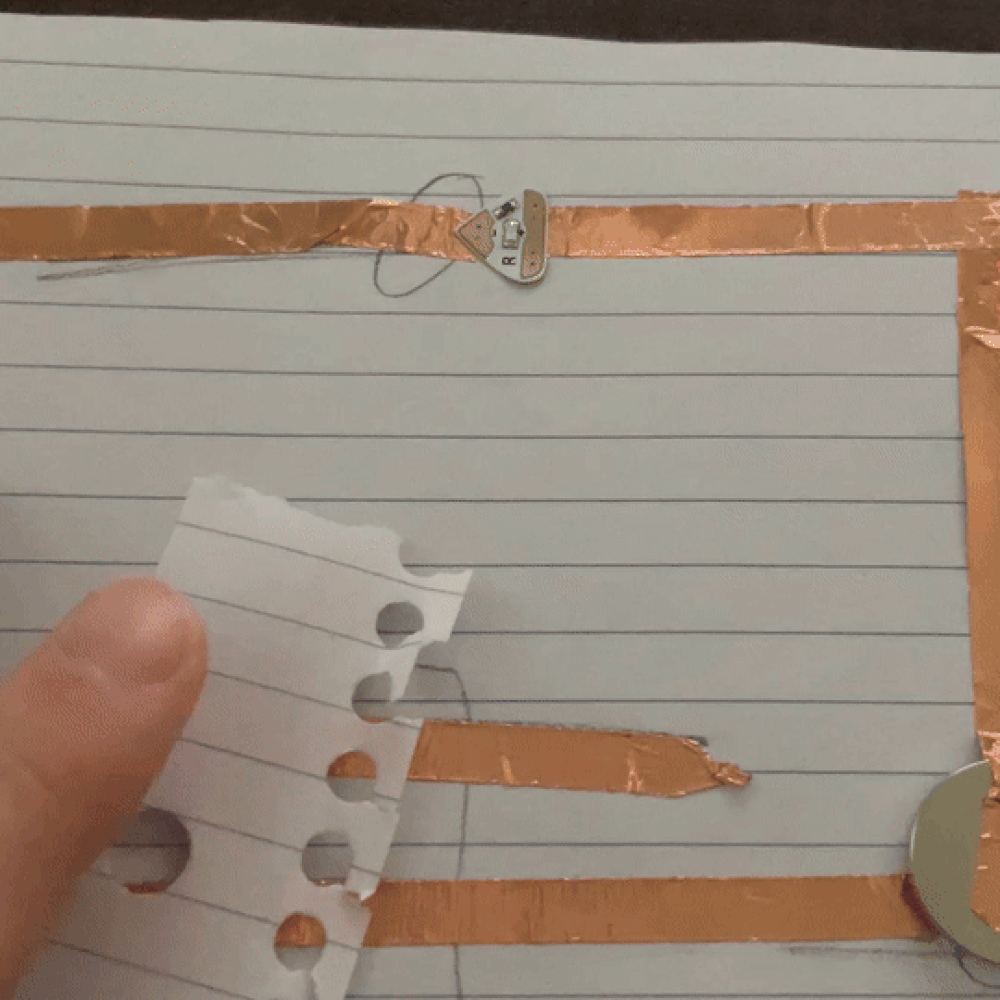 Connecting it with a basic paper with copper tape under it