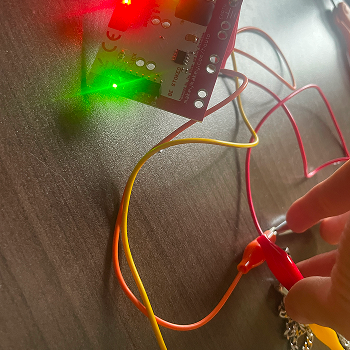 Using pencil graphite drawn directly on paper as a conductive path, connecting a clip to the drawn line and testing whether a finger dragged along it completes the circuit.